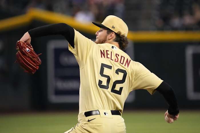 Sep 18, 2022; Phoenix, Arizona, USA; Arizona Diamondbacks starting pitcher Ryne Nelson (52) pitches against the San Diego Padres during the first inning at Chase Field. Mandatory Credit: Joe Camporeale-USA TODAY Sports